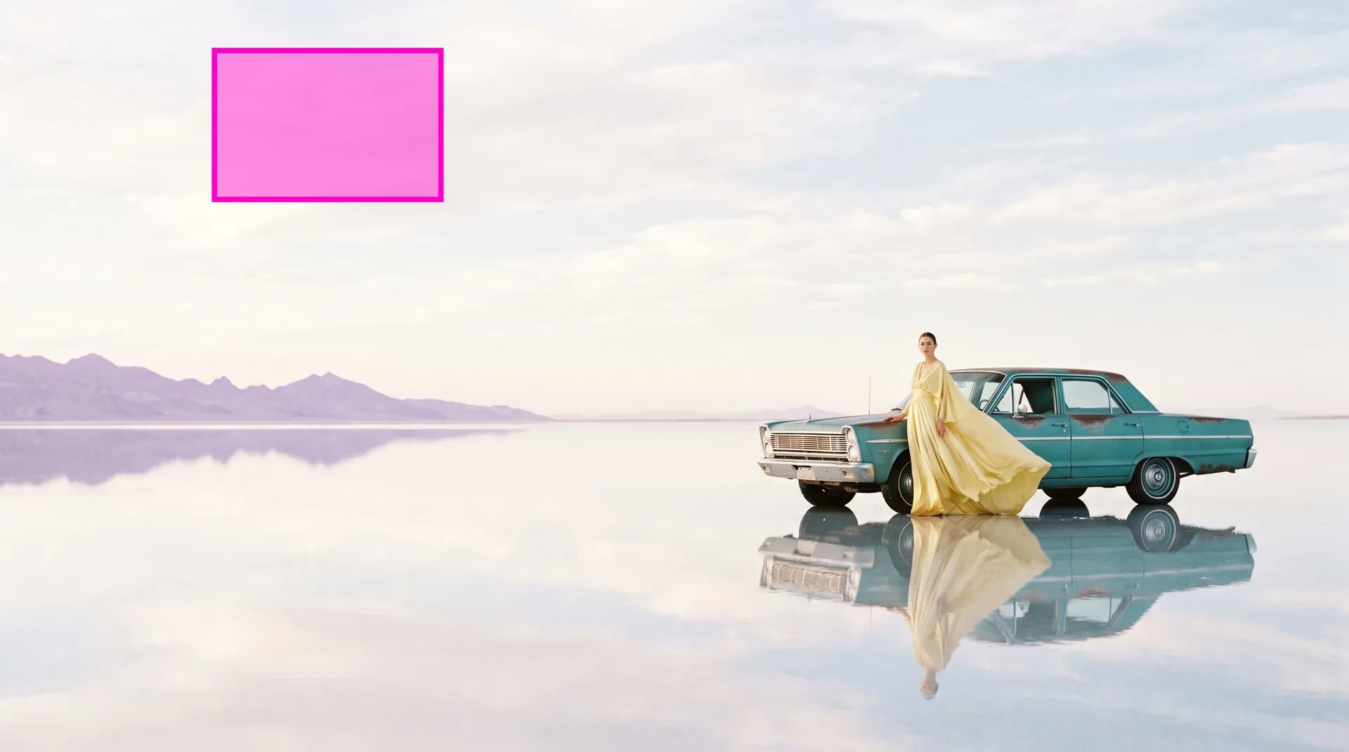 AI-generated photo of a model in a yellow gown beside a teal car on a mirrored salt flat, with a magenta box drawn in the empty sky
