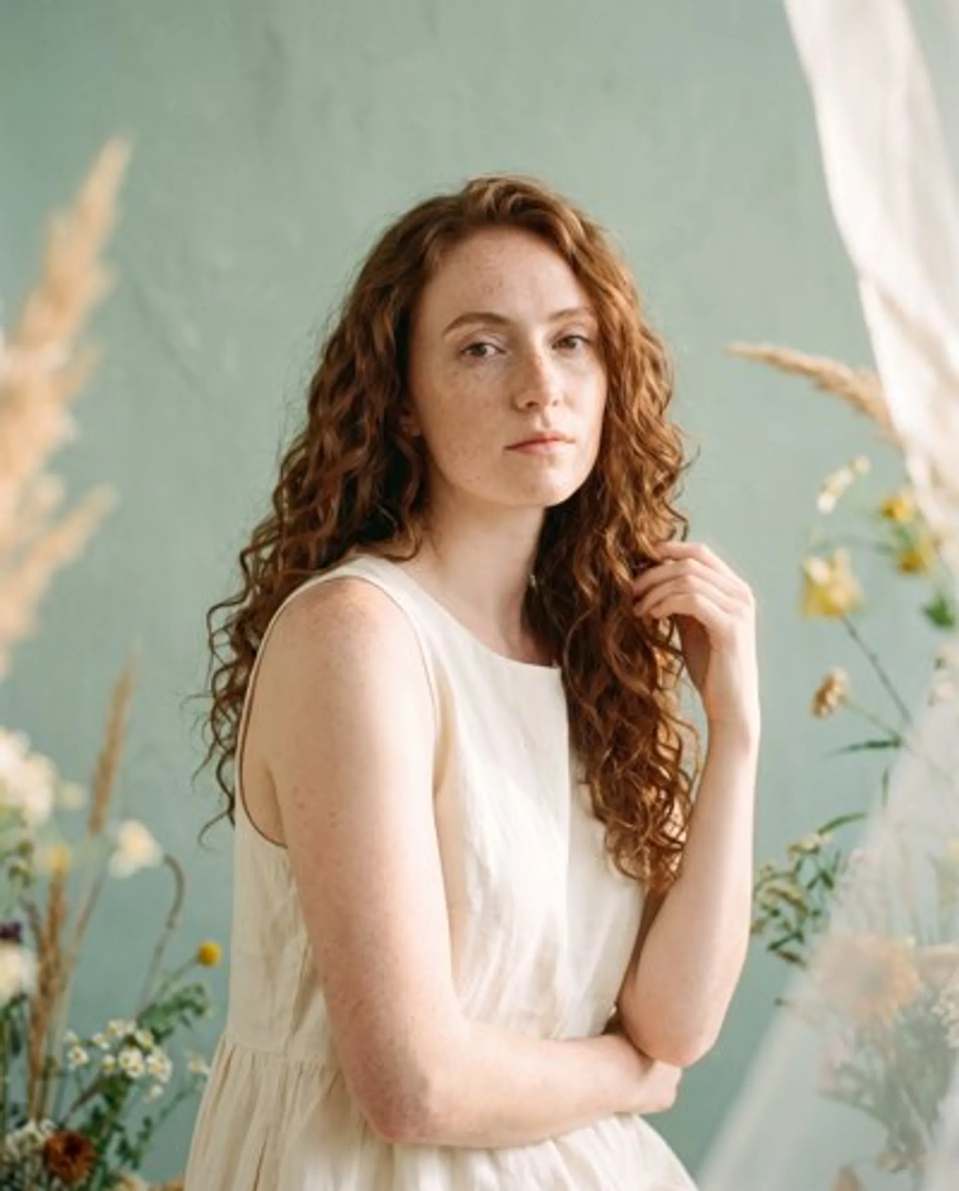 Reference 1: portrait of a woman with auburn curls
