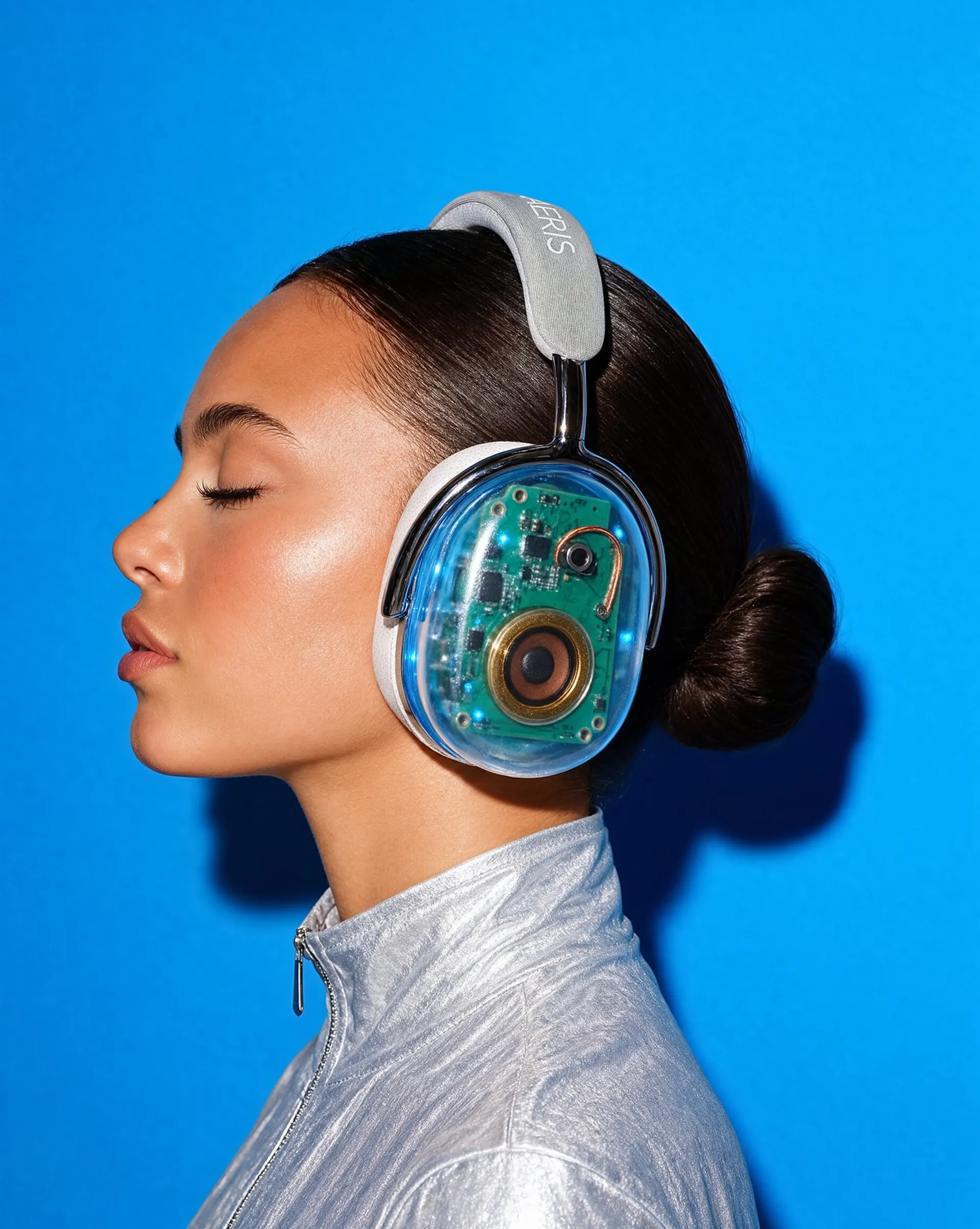 Krea 3 image of a woman in profile wearing the same headphones against a cerulean backdrop