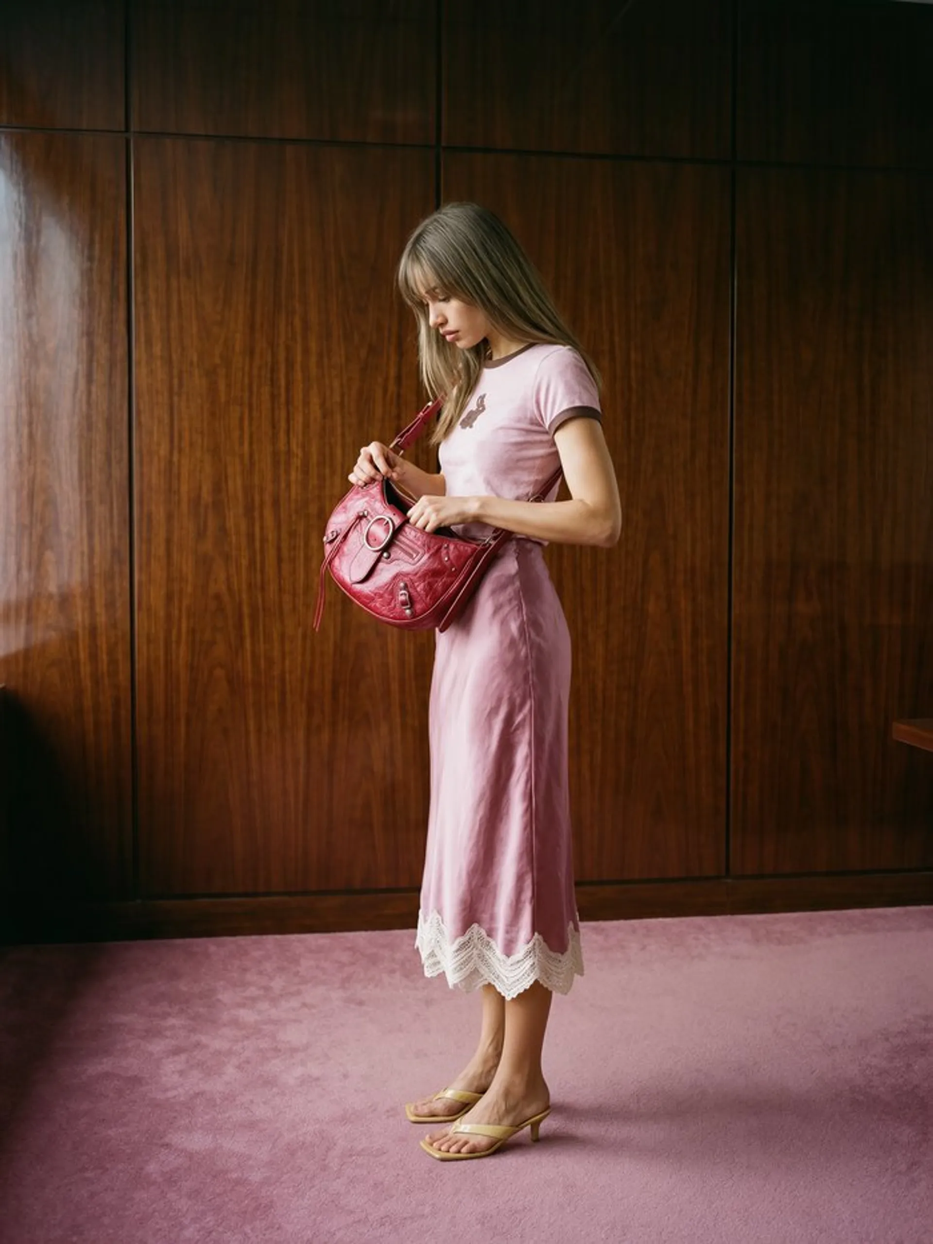 Krea 3 image of the same woman in side profile looking into her red bag